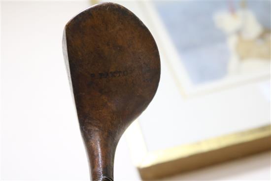 Two wooden drivers by Armstrong & Co and Paxton, a gun metal putto signed Jacques, 7 other and a golf ball